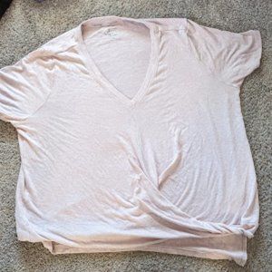 Light pink Calvin Klein shirt with a twist, good condition!